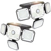 Set of four solar-powered motion sensor lights on a white background