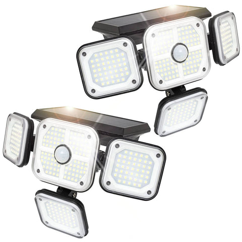 Set of four solar-powered motion sensor lights on a white background