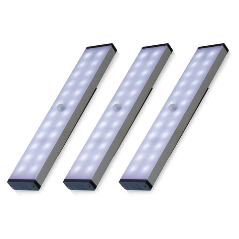Three LED motion sensor lights on a white background