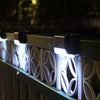 Set of four waterproof Solightify solar decking lights for garden paths, ideal for winter outdoor landscaping.
