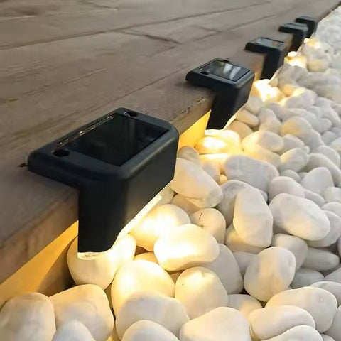 Set of four Solightify waterproof solar decking lights for garden paths, ideal for winter outdoor lighting.