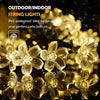 Warm white Solightify solar fairy garden string lights with waterproof technology, ideal for outdoor garden decoration.
