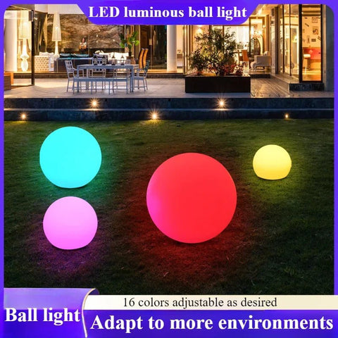 Solightify LED Mood Light Sphere solar garden light with 16 colors, 4 modes, remote control, and USB charging in a garden setting.