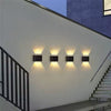 Two Solightify solar garden spot lights with waterproof up and down design, warm white light, and sensor for outdoor wall lighting.