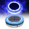 Solightify solar floating pool light illuminating a swimming pool with colorful LED lights at dusk.